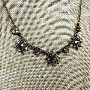 Anne Koplik Designs bronze tone starburst necklace with chocolate colored stones